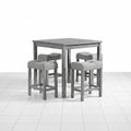 Gray dining table with chairs under table