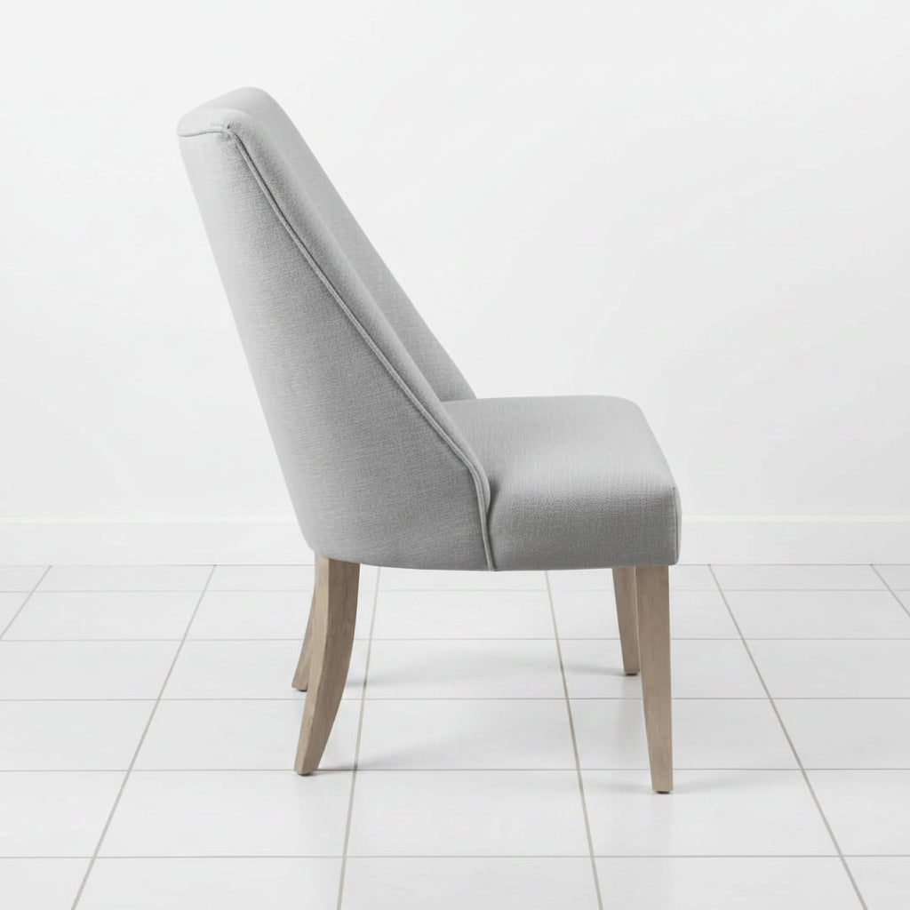 Light grey dining chair with solid wood legs