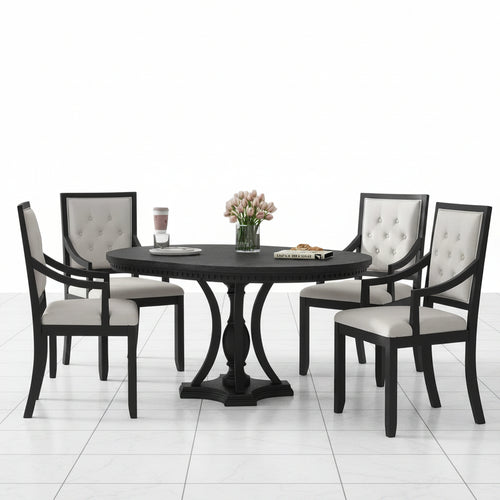 Round dining table with four chairs in black and oak